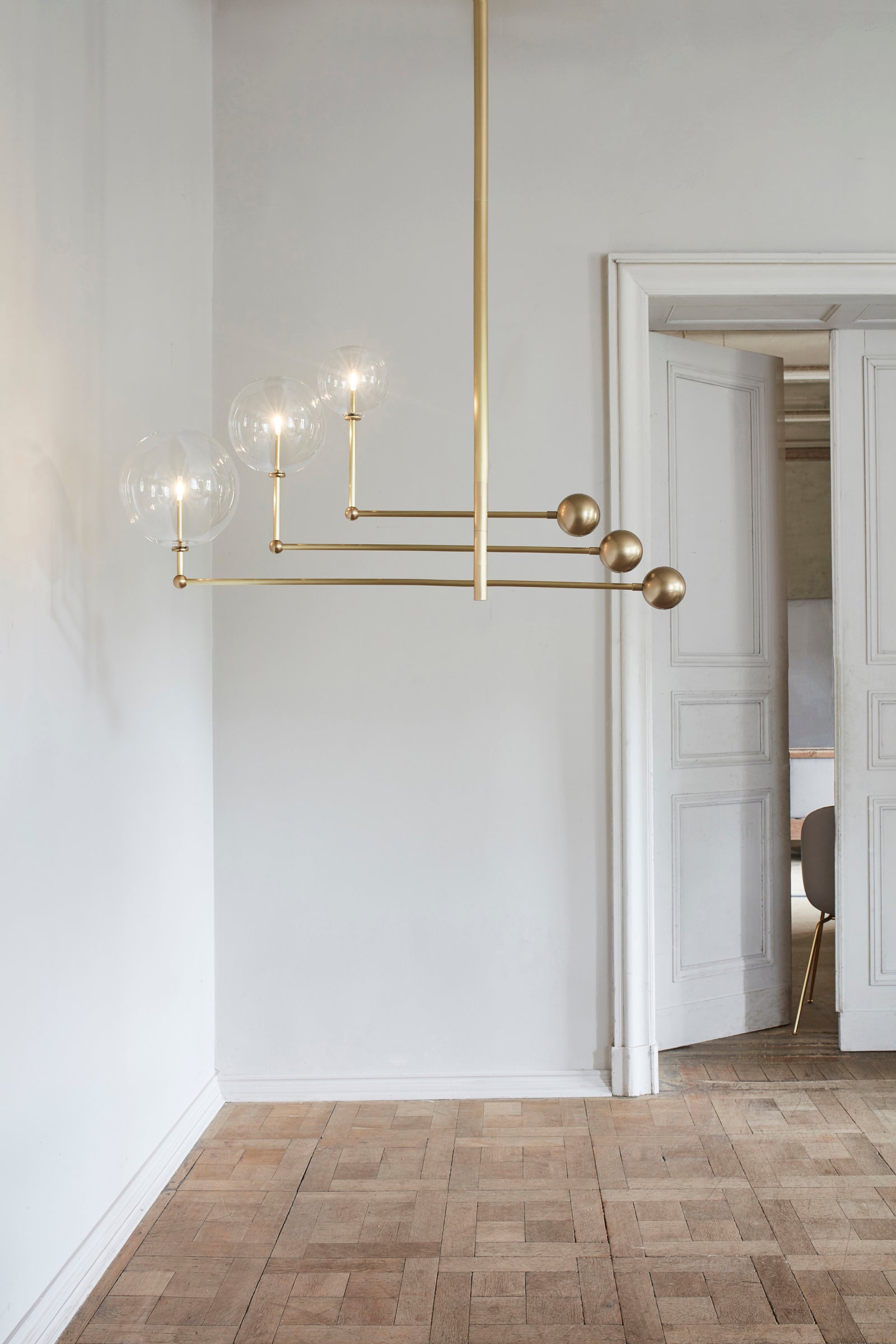 Schwung Universe Burnished Brass Transparent Globe Chandelier